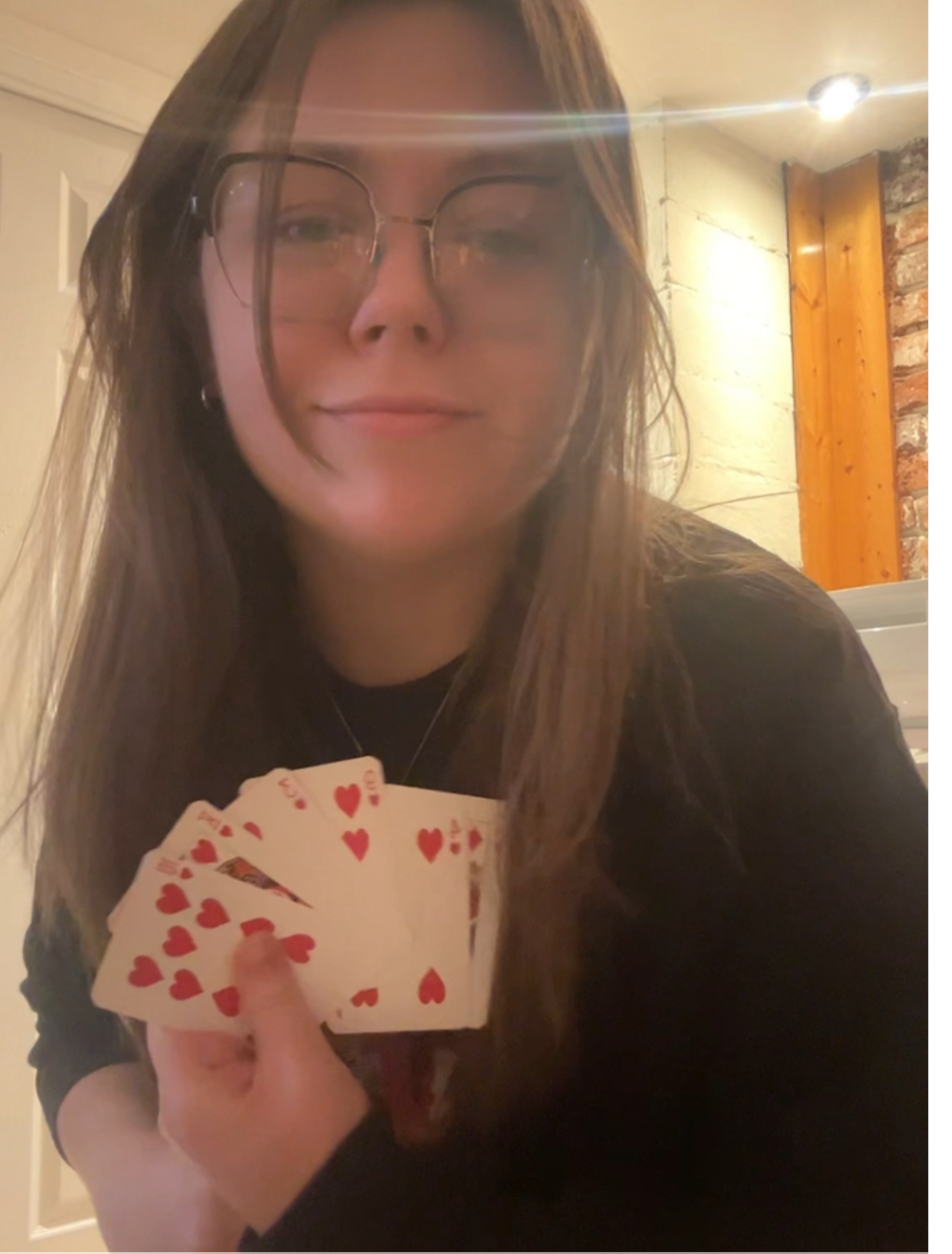 Morgan holding 5 heart cards